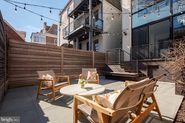 view of patio featuring fence