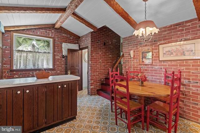 dining area featuring light floors, a notable chandelier, brick wall, stairs, and lofted ceiling with beams