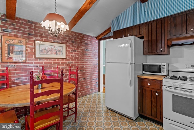 kitchen featuring white appliances, under cabinet range hood, brick wall, a notable chandelier, and vaulted ceiling with beams