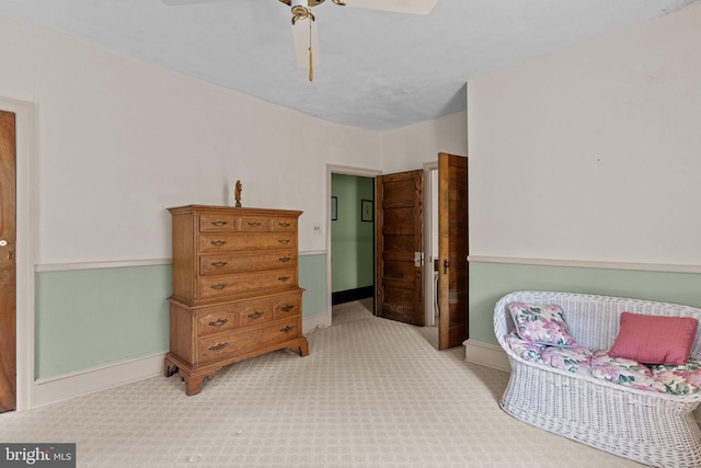 bedroom with baseboards, ceiling fan, and carpet