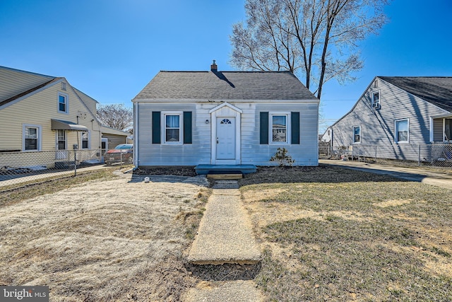 bungalow-style house with a front lawn, a chimney, a shingled roof, and fence