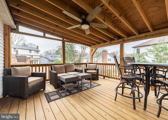 deck with an outdoor hangout area and a ceiling fan