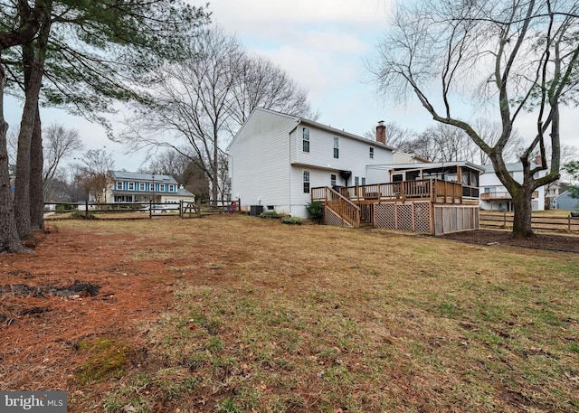 view of yard featuring stairs, fence, and a wooden deck