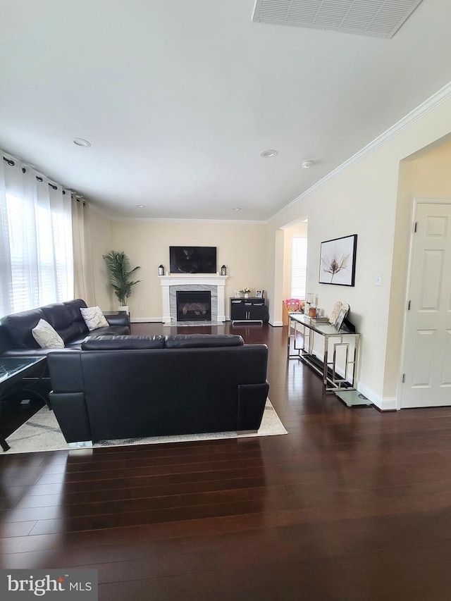 living room featuring crown molding and dark hardwood / wood-style floors