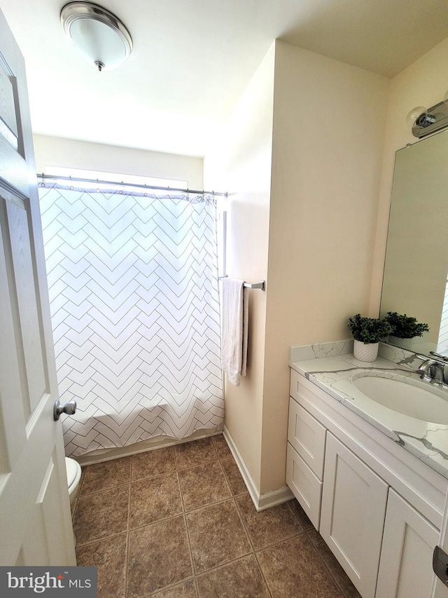 full bathroom with vanity, toilet, tile patterned flooring, and shower / bath combo