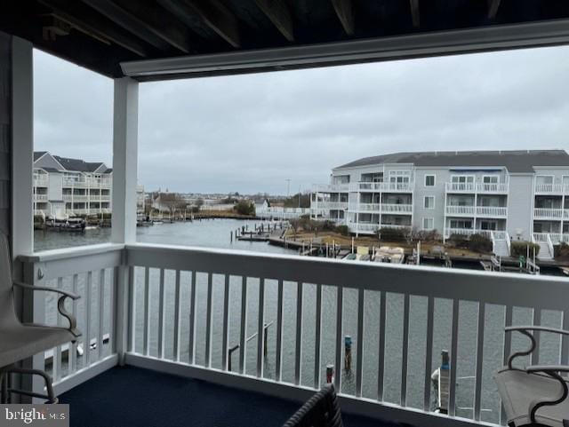 balcony featuring a water view