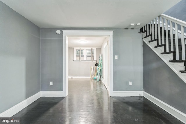 unfurnished room with wood-type flooring