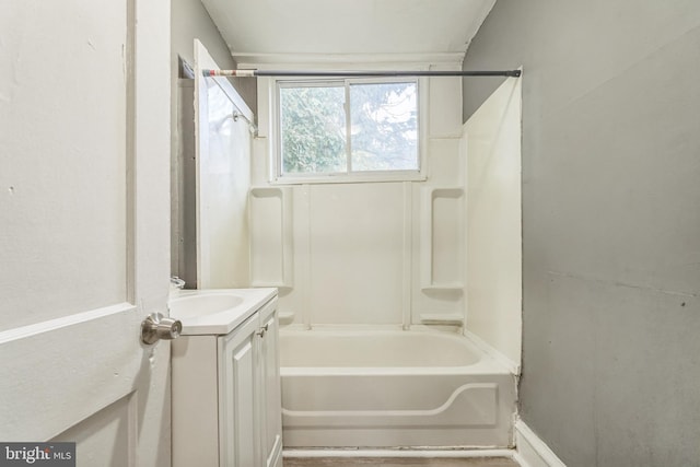 bathroom with vanity and washtub / shower combination