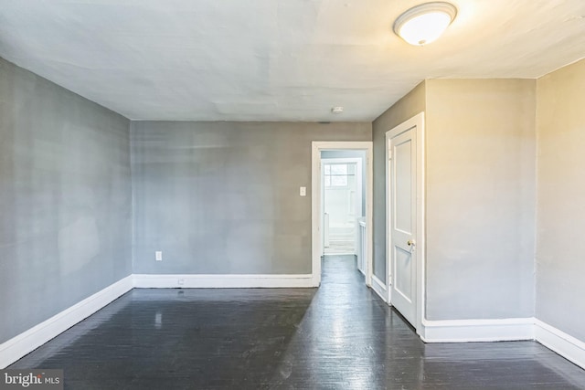 empty room featuring dark hardwood / wood-style floors