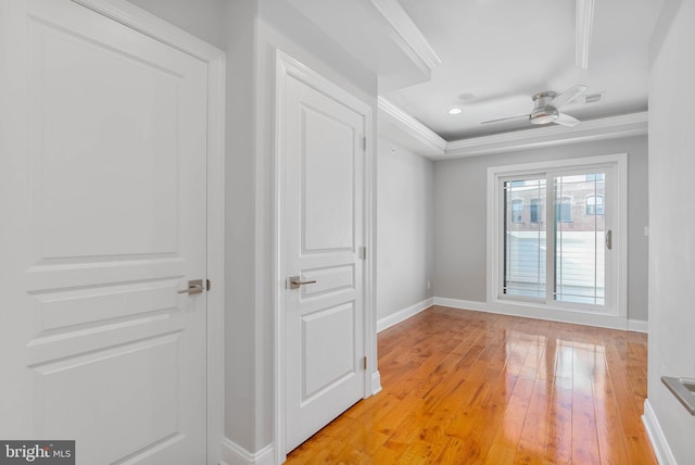 unfurnished room featuring recessed lighting, ornamental molding, a ceiling fan, baseboards, and light wood-type flooring