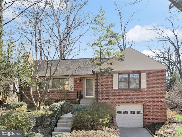 view of front of house with a garage, brick siding, and driveway