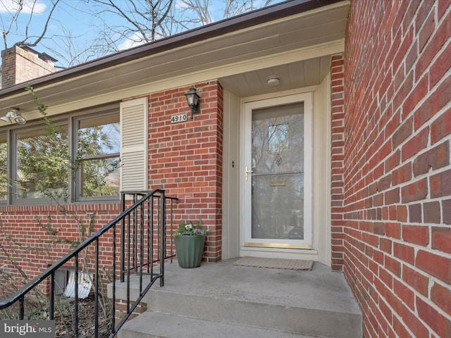 property entrance with brick siding