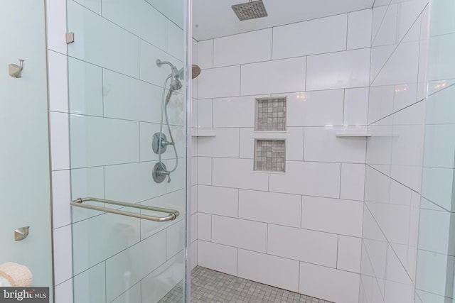 bathroom with a shower stall