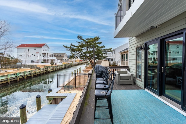 exterior space featuring a water view and a residential view