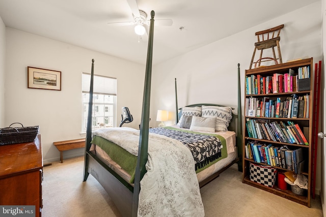 bedroom with light carpet and ceiling fan