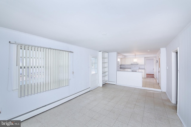 unfurnished living room featuring a baseboard heating unit