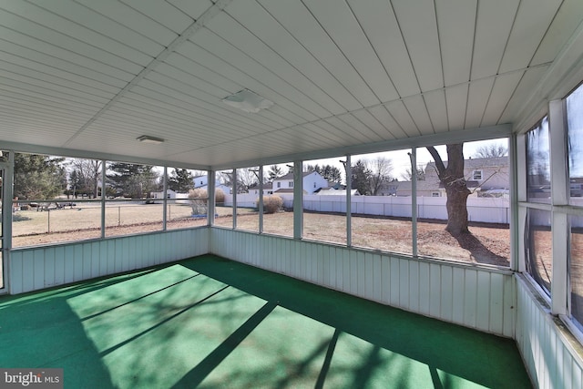 unfurnished sunroom with plenty of natural light