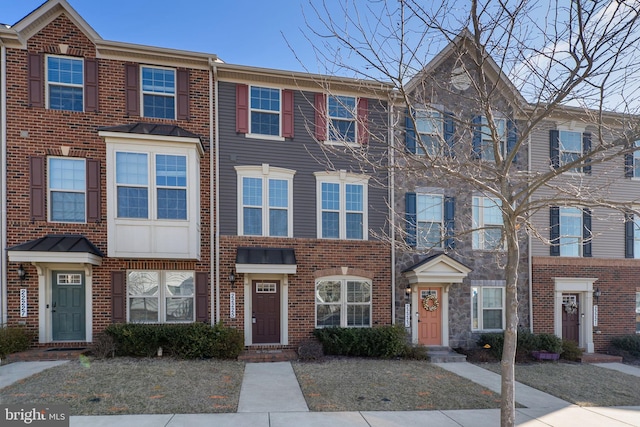 multi unit property featuring brick siding