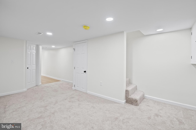 basement with light colored carpet