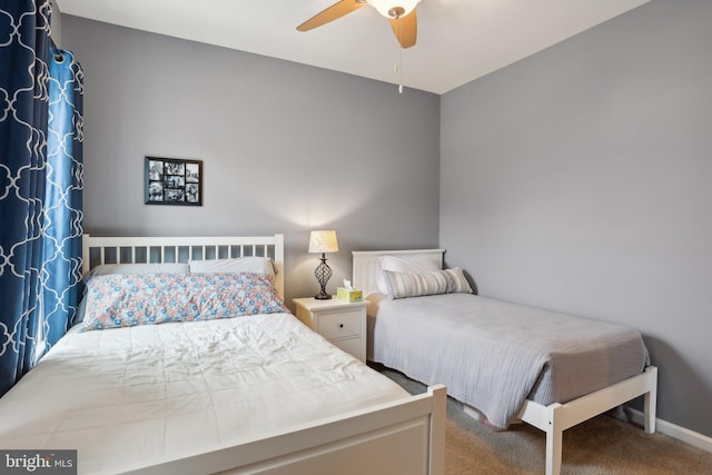 bedroom featuring carpet floors, ceiling fan, and baseboards