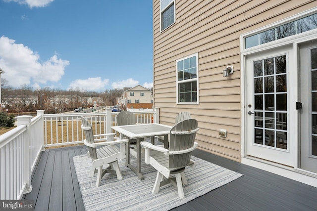 wooden deck with outdoor dining space