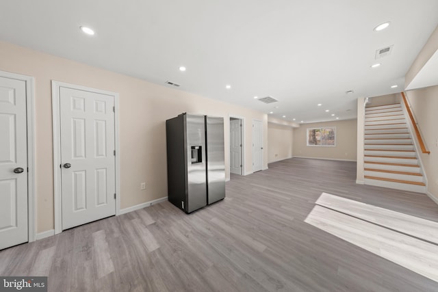 interior space with recessed lighting, visible vents, light wood-style floors, and stairway