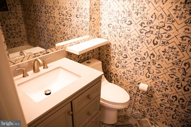 bathroom with vanity and toilet