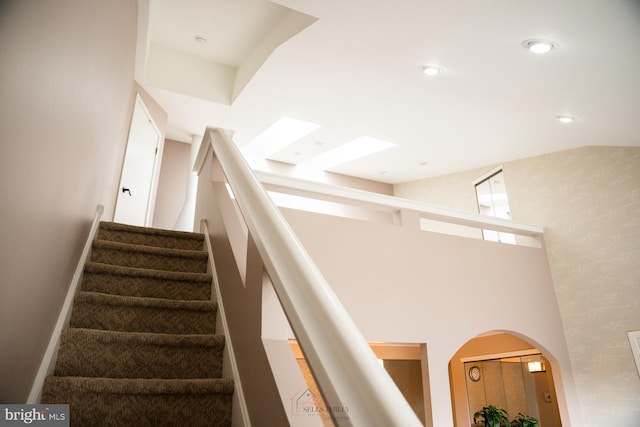 stairs with a towering ceiling