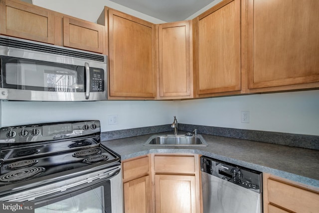 kitchen with appliances with stainless steel finishes and sink