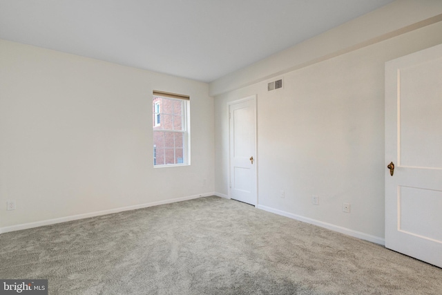 unfurnished room with carpet flooring