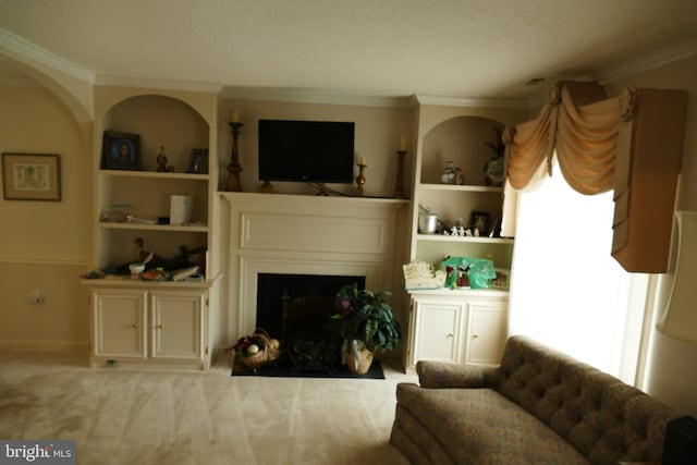 carpeted living room with plenty of natural light, a fireplace, crown molding, and built in features