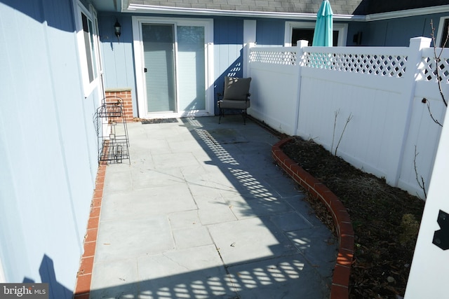 view of patio / terrace featuring fence