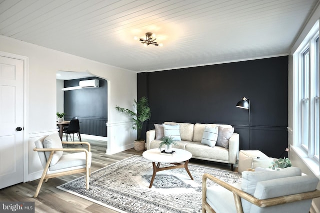 living room featuring wood ceiling, a wall mounted air conditioner, and hardwood / wood-style floors