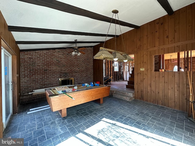 6308 Beechwood, Idlewylde, MD 21239 - playroom with brick wall, wooden walls, lofted ceiling with beams, and a textured ceiling