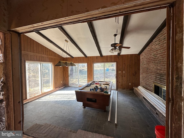 6308 Beechwood, Idlewylde, MD 21239 - playroom with ceiling fan, lofted ceiling with beams, a brick fireplace, and wood walls