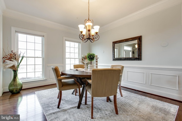 dining room featuring hardwood / wood-style floors, an inviting chandelier, and a healthy amount of sunlight