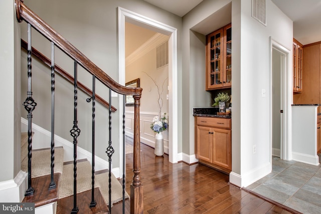 interior space with crown molding and dark hardwood / wood-style floors