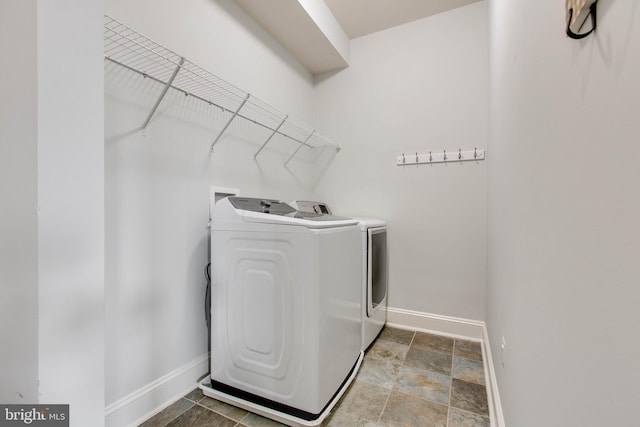 laundry area with independent washer and dryer