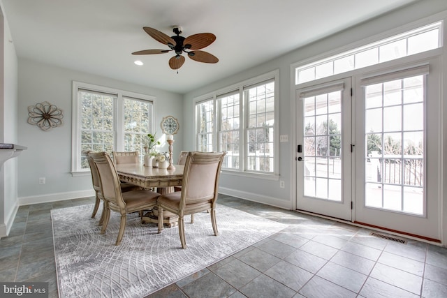 dining area featuring ceiling fan and a wealth of natural light