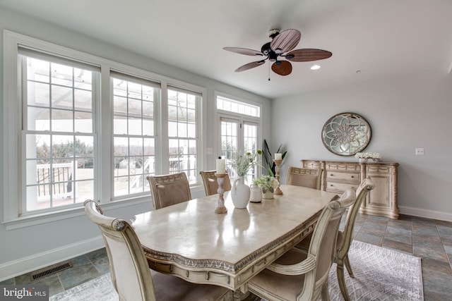 dining space featuring ceiling fan