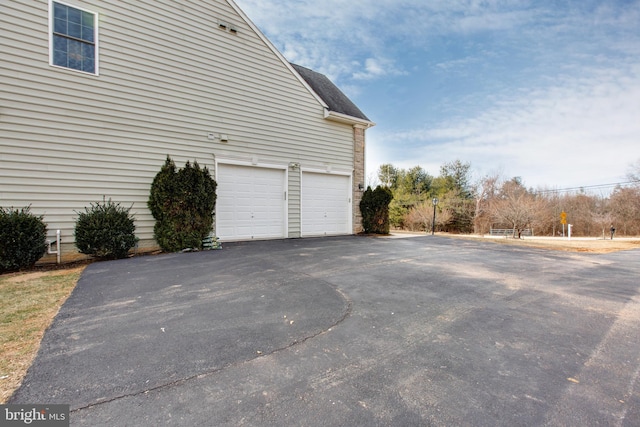 view of side of property featuring a garage