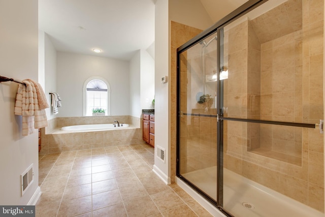 bathroom with tile patterned floors, separate shower and tub, and vanity