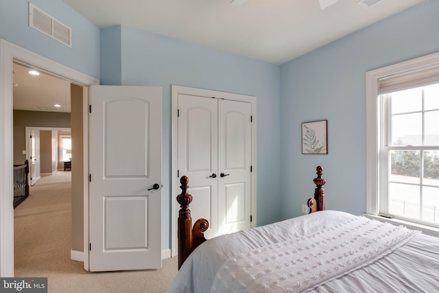 carpeted bedroom with a closet