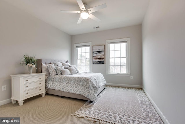 bedroom featuring ceiling fan and light carpet