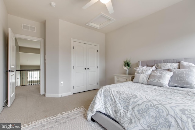 bedroom with light carpet, a closet, and ceiling fan