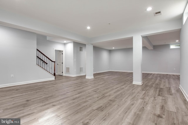 basement featuring light hardwood / wood-style flooring