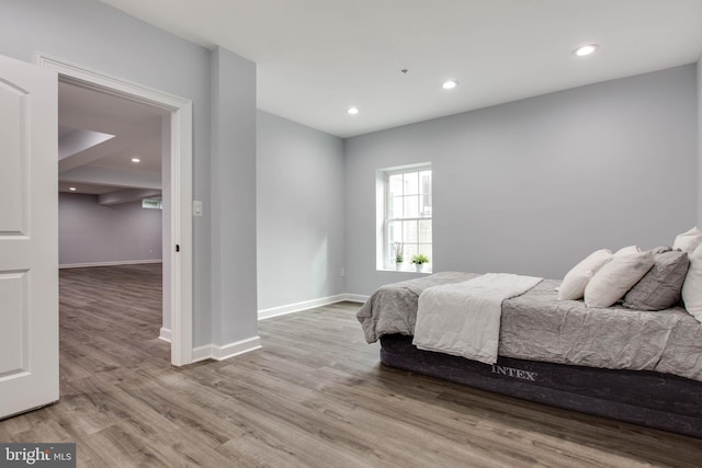 bedroom with light hardwood / wood-style flooring