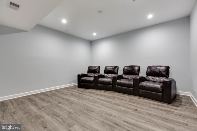 home theater featuring light wood-type flooring