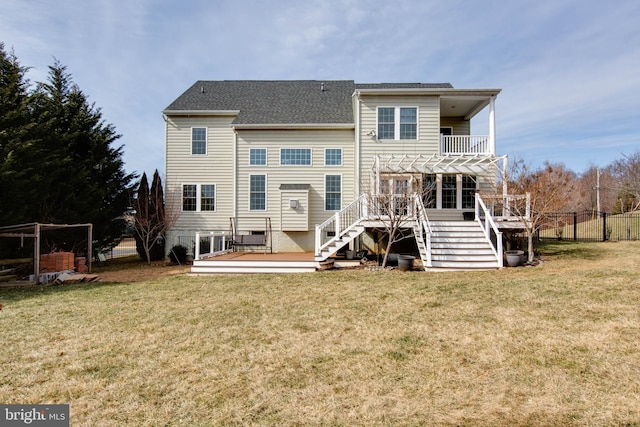 back of house with a yard, a deck, and a pergola