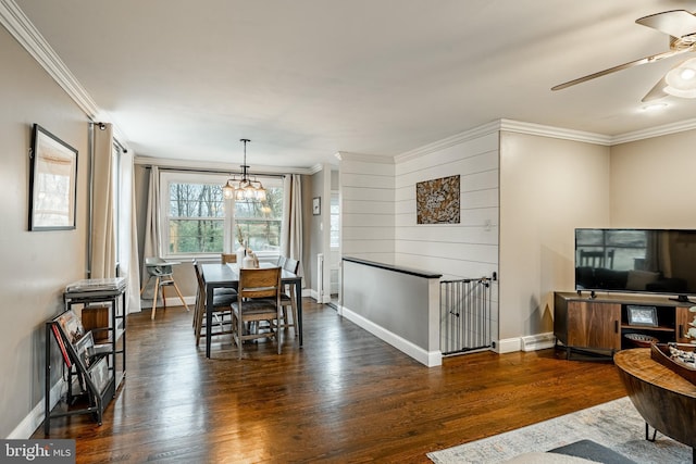 dining room with ceiling fan with notable chandelier, dark wood finished floors, and crown molding